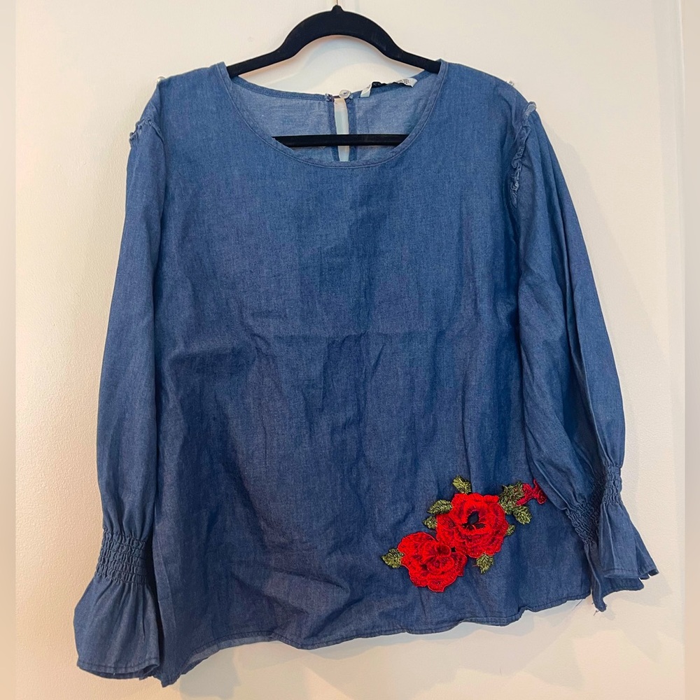 Women’s long sleeve denim blouse with red flower print. Size is 3XL